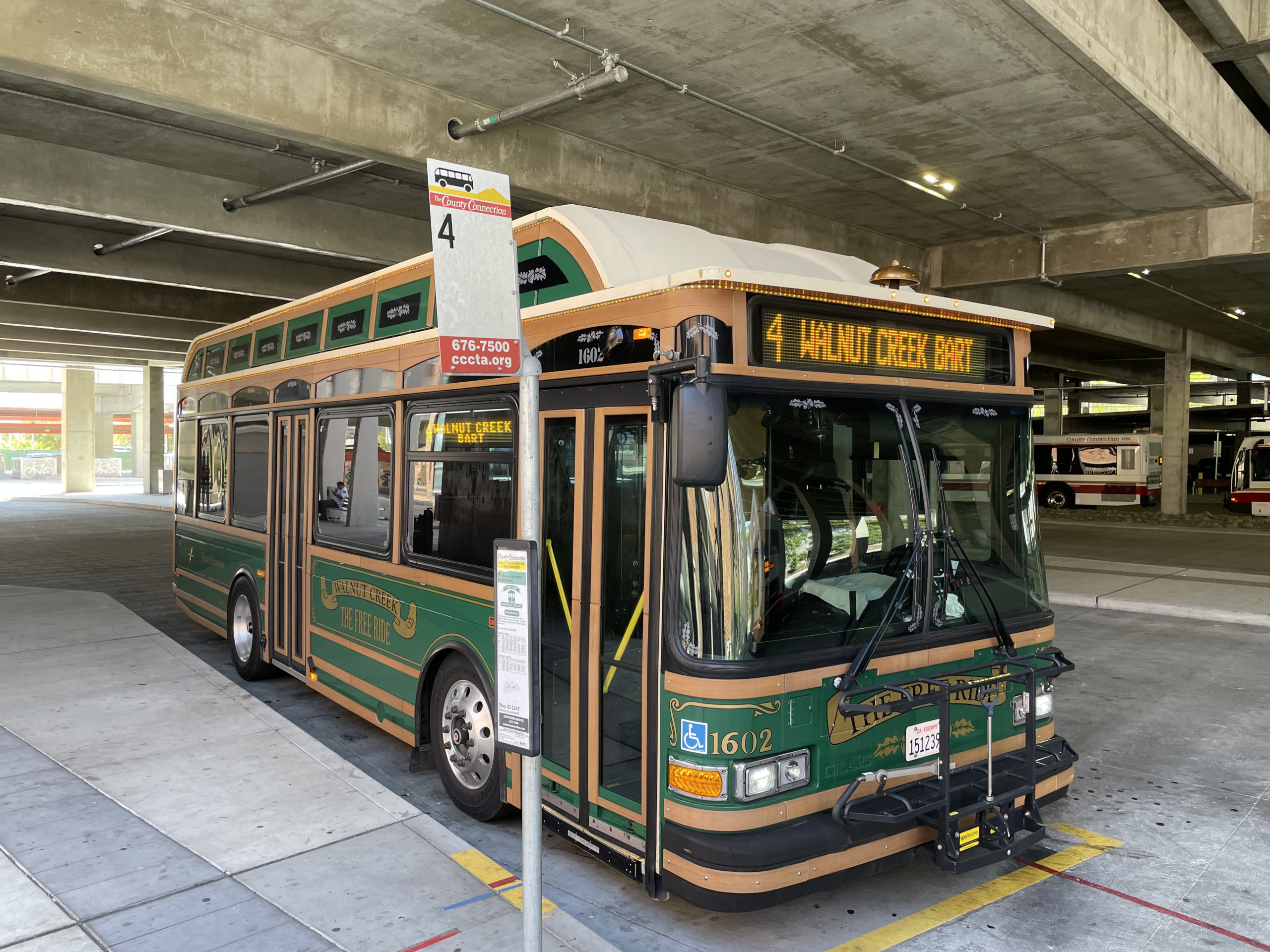 Gillig Trolley Replica Electric Bus on WAVE charging pad - Walnut Creek BART Station.